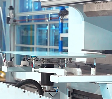 EV Charger Housing Bending Process in Factory Workshop Smart bending machine shaping EV charger housing panels in a factory workshop, part of the charging station production process.