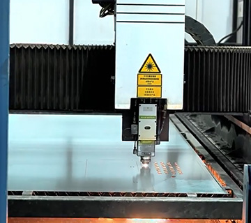 Precision laser cutting of EV charger housing panels at AnengJi factory Laser cutting machine processing EV charging station housing material in factory workshop