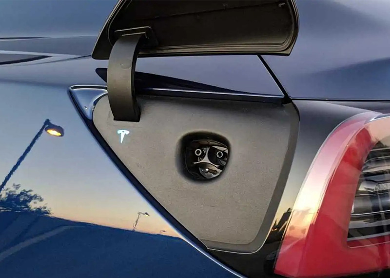 Tesla EV charging port on car body showing location and J1772 adapter compatibility for Level 2 home and public charging