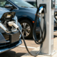 Electric vehicles charging at public parking spaces using EV charging stations