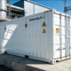 A large-scale containerized industrial battery energy storage system (BESS) installed at a manufacturing plant to reduce commercial energy storage system cost.