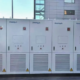 Anengji 500kW/1165kWh **lithium ion battery energy storage** system deployed in a New Zealand industrial park for frequency regulation.