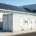 A large-scale commercial solar battery storage system installed at an industrial facility to optimize electricity costs.
