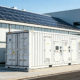 A large-scale commercial solar battery storage system installed at an industrial facility to optimize electricity costs.