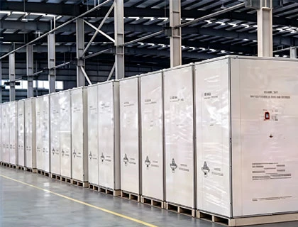 packaged BESS battery storage containers stored in warehouse ready for shipment