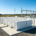 A utility-scale grid connected battery storage installation featuring containerized LFP racks and a high-voltage substation.