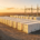 A utility scale stationary battery storage plant featuring industrial energy storage containers for grid stability.
