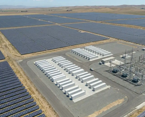 A massive front of the meter 100MW utility scale battery storage project installed at a regional substation grid terminal.