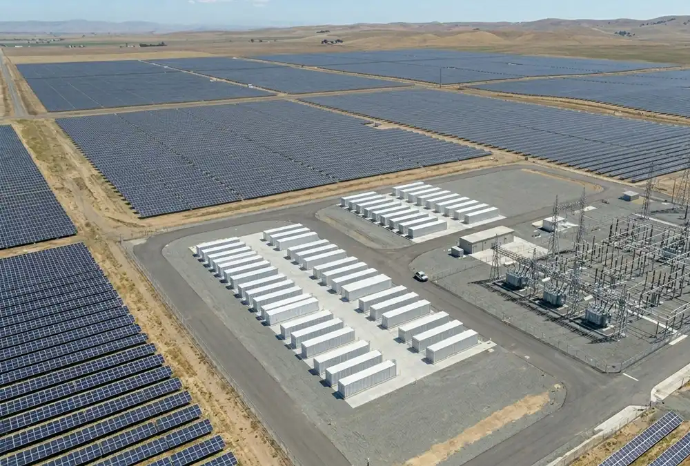 A massive front of the meter 100MW utility scale battery storage project installed at a regional substation grid terminal.
