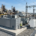 Turnkey containerized 1MW battery storage solutions installed on a concrete foundation at a commercial industrial facility for facility peak shaving.