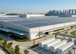 Implementing an integrated project delivery model featuring rooftop solar arrays and commercial battery storage containers.