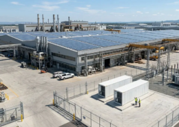 Deploying high-capacity industrial solar battery storage systems in containerized configurations next to a manufacturing facility.