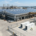 Deploying high-capacity industrial solar battery storage systems in containerized configurations next to a manufacturing facility.