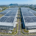 High-capacity industrial solar systems installed on a large manufacturing facility roof to reduce production overhead costs.