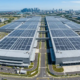 High-capacity industrial solar systems installed on a large manufacturing facility roof to reduce production overhead costs.