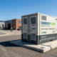 A turnkey 1MW commercial battery storage system container deployed at a manufacturing facility for peak shaving and cost reduction.