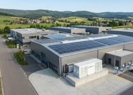 A complete turnkey commercial solar plus storage system cost investment featuring rooftop PV arrays and containerized LFP battery packs in Europe.