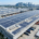 High-efficiency turnkey solar solutions for commercial buildings installed on a modern logistics hub rooftop.