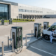 Commercial outdoor parking site with DC fast charging stations showing installation layout and equipment investment