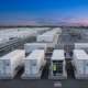 High-voltage containerized BESS architecture with step-up transformer connected to an industrial utility grid