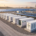 Turnkey industrial containerized BESS for solar farms co-located with utility-scale PV arrays under a morning sky.
