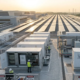 Modern commercial building rooftop with clean solar panels demonstrating the key benefits of using solar energy