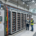 A state-of-the-art commercial energy storage system integrated with rooftop solar panels, demonstrating the massive financial benefits of solar battery storage for businesses.
