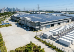 An optimized commercial battery storage sizing installation integrated with rooftop solar PV panels for an industrial factory.