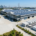 An optimized commercial battery storage sizing installation integrated with rooftop solar PV panels for an industrial factory.