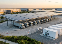 Integrated industrial solar battery storage system container and commercial solar carport at a modern logistics hub
