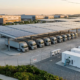 Integrated industrial solar battery storage system container and commercial solar carport at a modern logistics hub