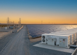 A vast utility-scale solar asset integrated with a modern solar farm battery storage system to maximize daily renewable generation revenue.