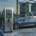 Sleek commercial electric car charging stations installed in a modern office building parking lot.