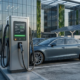 Sleek commercial electric car charging stations installed in a modern office building parking lot.