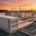 Industrial facility showing BESS vs diesel generator installation site with grid switchgear