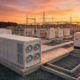 Industrial facility showing BESS vs diesel generator installation site with grid switchgear