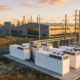 A commercial lithium battery energy storage system powering an industrial manufacturing plant.
