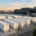 Large-scale battery energy storage system containers installed outside a modern data center with solar panels