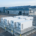AC-coupled battery storage beside a European factory with rooftop solar PV